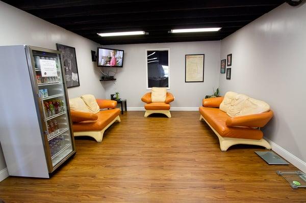 Our spacious lounge to relax or just hang out, featuring a tv, comfy couches, and a beverage center.