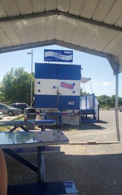 It's a food shack with outside seating and a nice breeze.