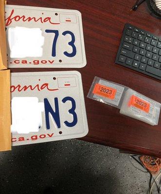 Plates and stickers provided by this office.