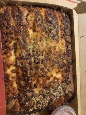 Inedible burned cheese sticks.