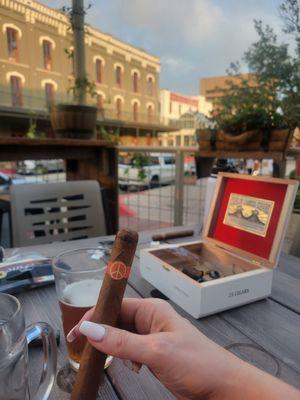 Customer enjoying a cigar on our garden patio