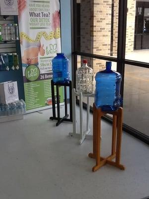 Accent your water bottles with a wooden stands.