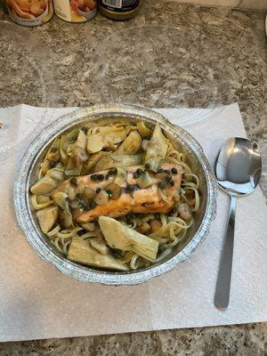 Salmon Piccata with artichoke hearts, capers, over linguine.