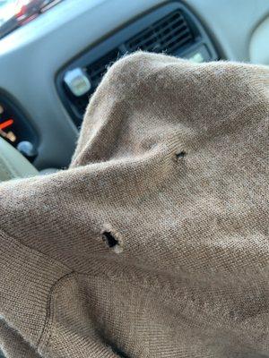 Sweater with holes courteous of the shop