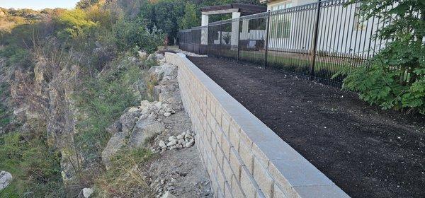 We built a retaining wall on the cliff's edge overlooking the Quarry golf course.