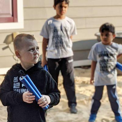 A member of our junior black belt class participating in Nunchuk Mondays!