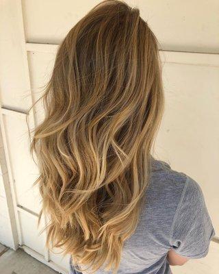 Natural blonde balayage with warm tones and dark root by Ryan Driggers.