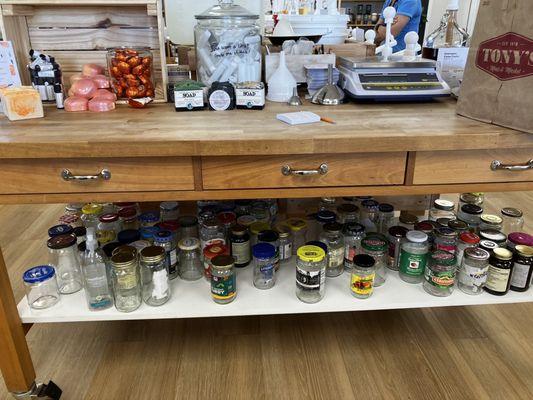 Reusable jars underneath that are donated and FREE.  Newer items for sale on top!