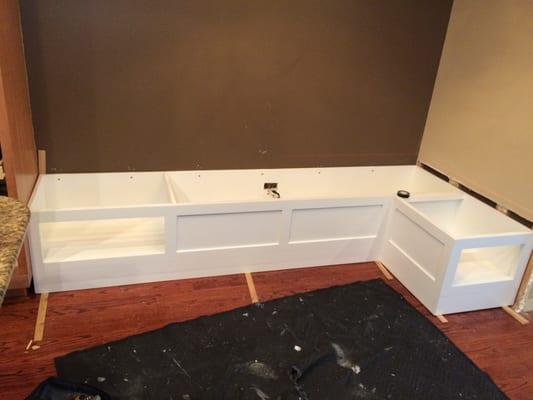 Bench frame cut/installed into wall.