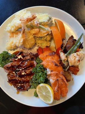 Steak and lobster combination plate with the tempura vegetables. Perfectly cooked!