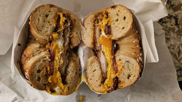 OMFC Fried chicken, egg, cheddar, and bacon on an everything bagel