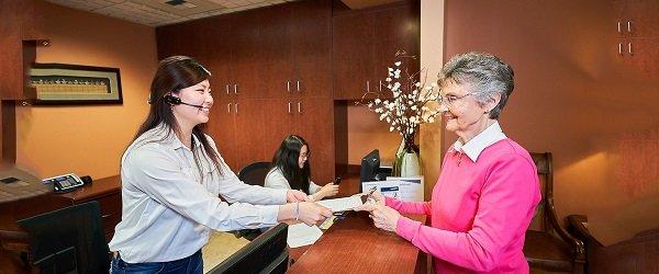 Our receptionist and a patient Renton dentist Hu Smiles in Renton