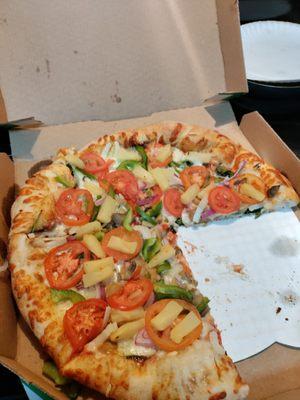 Vegetable pizza with added veggies.