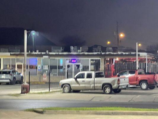 The outside of the bar. We were parked in front of the door with the open sign.