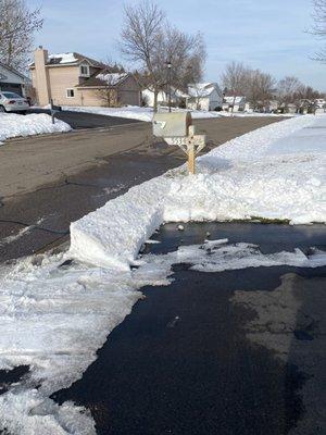 After I complained the driveway wasn't done full width this is what they did.  Notice mailbox is not cleared.  More snow and I don't get mai