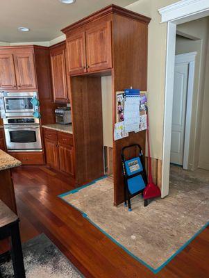 The fridge has been displaced, drywall removed, insulation removed etc.