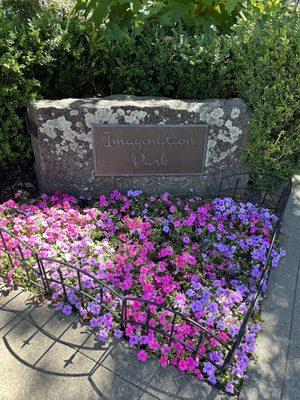 Sign and beautiful floral display at the park