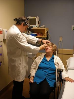 Dr. Gualtieri examining a patient for diabetic eye disease/ diabetic retinopathy