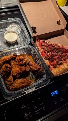 Wings and meat lovers pizza