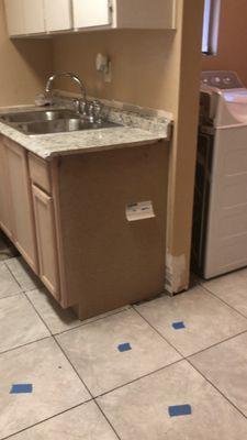 Midway point / Cabinet in / Tile going in / New sink and faucet