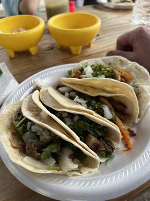 Left is Suadero tacos right is carnitas