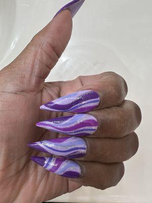 Purple stiletto nails.