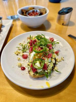 Half avocado toast with soft boiled egg - seriously one of the best dishes ever