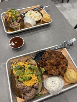 Pulled pork baked potatoes with cole slaw and baked beans and corn muffins