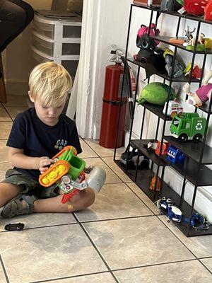 Look Daddy! There's a whole shelf of toys over there!