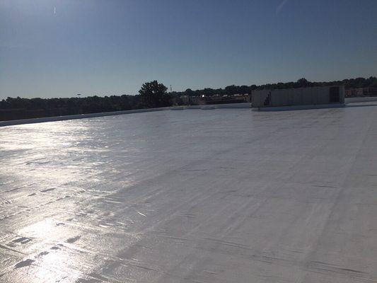 Beautiful Novatuff Epoxy coating over a failed mod bit roof.