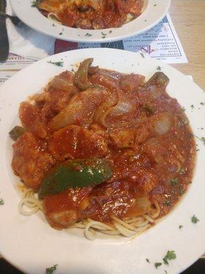 Delicious veal peperonata over spaghetti.