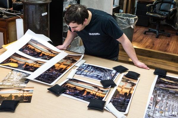 Duggal's Brian Renaldo inspecting test prints.