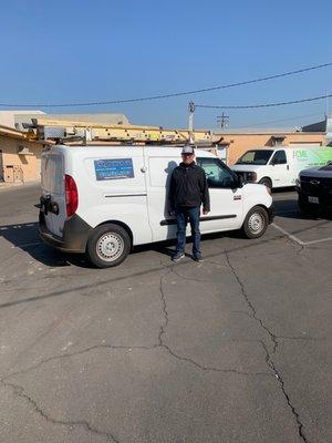 The owner on front of one of his trucks.