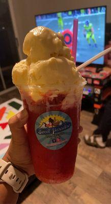 Strawberry raspado with vanilla ice cream on top