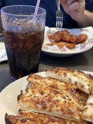 Cheese breadsticks, boneless barbecue wings, Pepsi