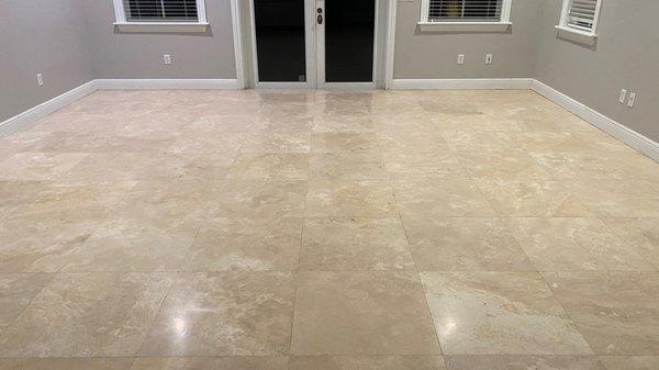 Filled holes & pitted travertine tiles--and polished.