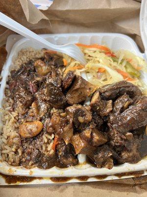 Small oxtail with cabbage. I asked for plantains and they gave me cabbage. The food is a little spicy