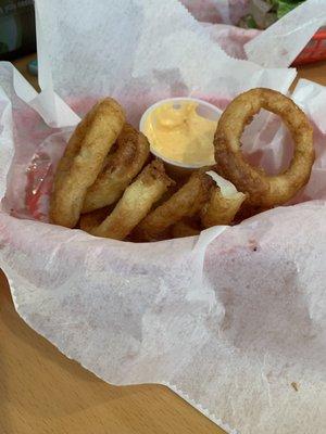 Onion rings very few for what you pay for them but the dipping sauce was good.