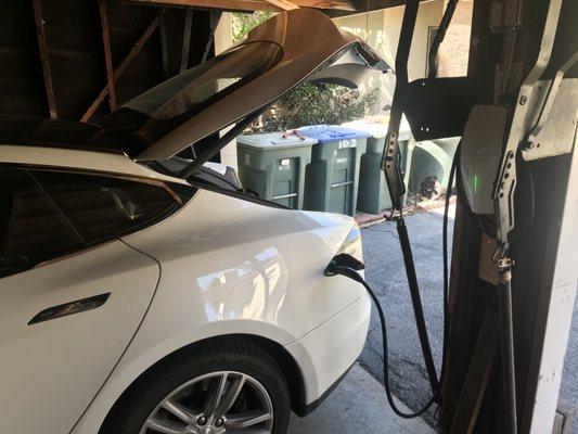 Car charging in the garage, using a new Tesla charger