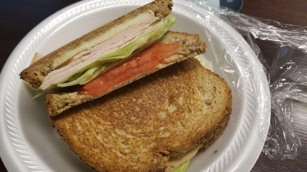 Hot turkey and cheese sandwich with lettuce and tomato. $4.75. Hit the spot!