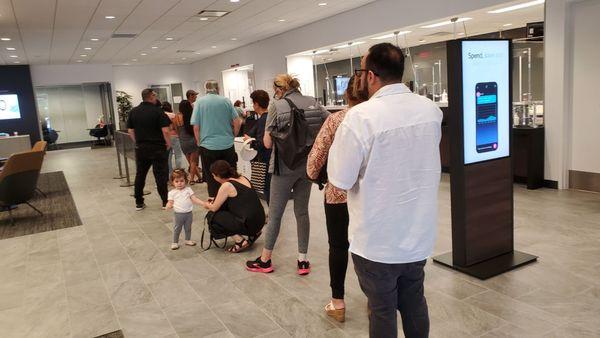 A line 16 people long on the first business day of the month. And there is ONE teller working.