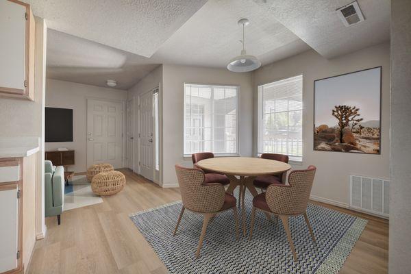 Dining room area with two windows and a ceiling light