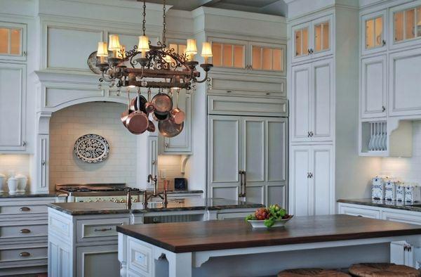 Large traditional kitchen with two large islands and paneled appliances