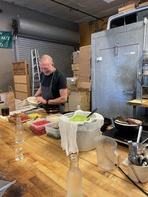 The chef, preparing rice and pickles bowls and explaining everything that goes into them, and how everything is made.