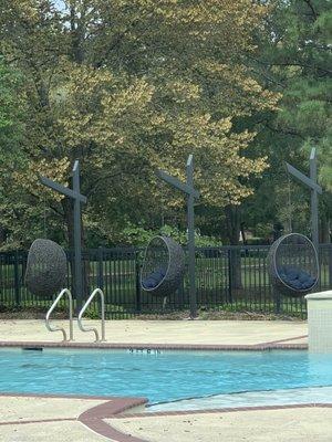 Epic swings poolside. }:{