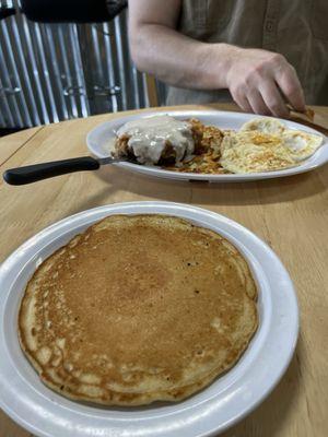 Chicken fried steak with a pancake on the side.