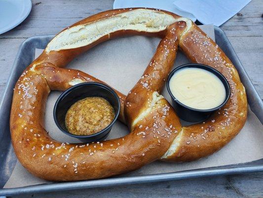 Giant pretzel with cheese and mustard