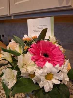 The arrangement Kremp Florist sent. None of the flowers here, including the wilted daisies were in the selected arrangement! Pitiful.