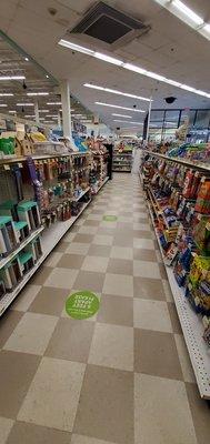 Physical distancing floor markers in the check out