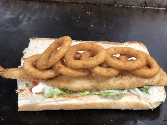 Slappin fried crispy whiting fish on a Italian roll with onion rings